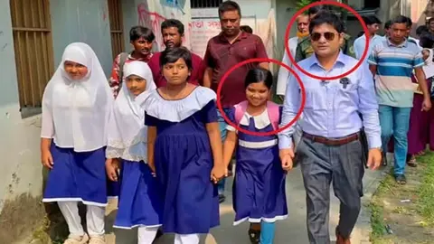 বাবার মুখে রুটি তুলে দেওয়া সেই শিশুর হাত ধরে স্কুলে নিয়ে প্রশংসায় ভাসছেন ইউএনও
